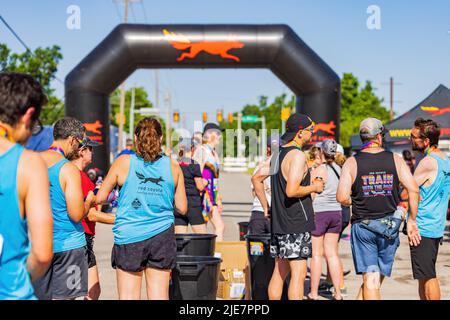 Oklahoma, JUN 25 2022 - Sunny view of the red coyote running event Stock Photo