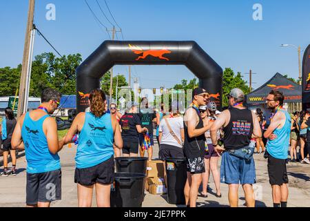 Oklahoma, JUN 25 2022 - Sunny view of the red coyote running event Stock Photo