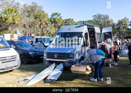 Unwanted goods and items for sale including surfboards at a car boot sale in Avalon Beach,Sydney,NSW,Australia June 2022 Stock Photo