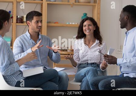 Multi ethnic staff members engaged in group meeting Stock Photo