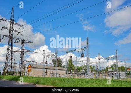 high-voltage electrical substation against the blue sky Stock Photo