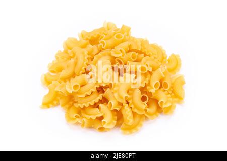 Dried macaroni cockerel scallops. Heap of pasta on white background. Top view. Stock Photo