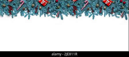 White Christmas background with Christmas tree branches and red berries, winter festive composition. Flat lay composition with winter fir branches, co Stock Photo