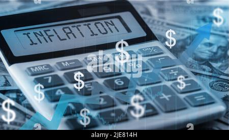 inflation text on calculator on us dollars background. calculation of price increases, the cost of products and goods. Monetary Inflation Stock Photo