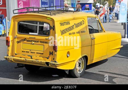 Trotters clean yellow Reliant Regal Supervan also referred to as Reliant Robin in Only Fools and Horses TV show parked Romford Market East London UK Stock Photo