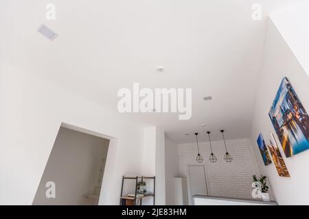 White ceiling with spot lights in room Stock Photo