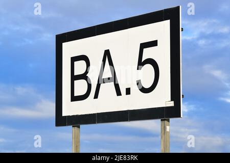 Omicron subvariant BA.5 virus mutation concept with text on billboard Stock Photo