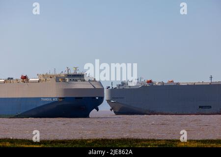 Ship one heading into port the other heading out to sea Stock Photo