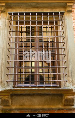 Characteristic protective grating on a historic building in Lucca Stock Photo