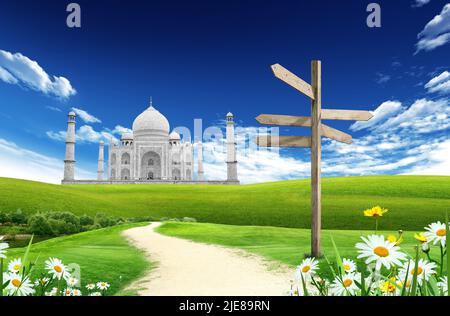 Landscape with country road and Taji Mahal, Agra landmark, India, in the  background with blue sky and clouds Stock Photo - Alamy