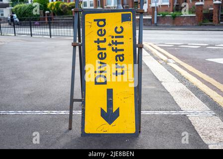 Diverted traffic sign, pointing to the ground. Diversion arrow direction sign. Unusual situation, going to hell concept Stock Photo