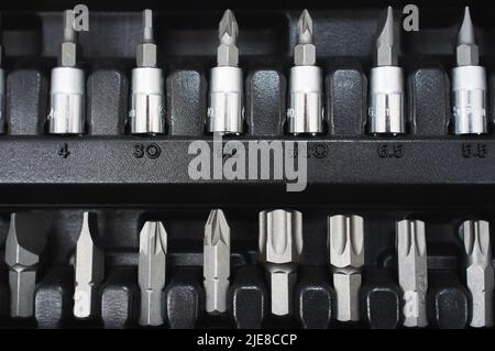 Set of screwdriver bits on toolbox Stock Photo