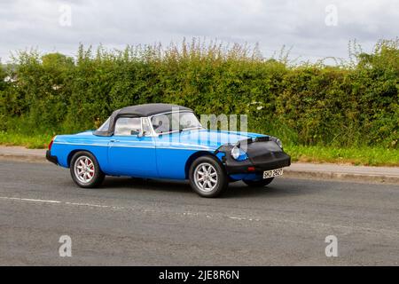 1978 70s Modified MG B blue 1798cc british sports car, fitted with Nose Bra to stop stone chips; en-route to Capesthorne Hall classic May car show, Cheshire, UK Stock Photo