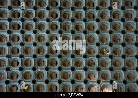 Black plastic doormat texture. View from the top. Beautiful background. Stock Photo