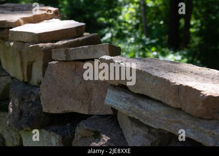 Stack of stones. Stone stack wall in the forest. Stock Photo