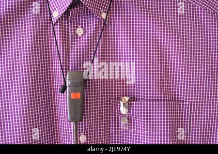 Podcasting concept, vintage recording microphone on a purple shirt, free copy space Stock Photo
