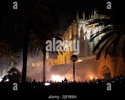 Palma de Mallorca, Spain; June 23rd 2022: Fireworks and the crowd by the Cathedral of Palma de Mallorca celebrating the night of San Juan 2022 Stock Photo