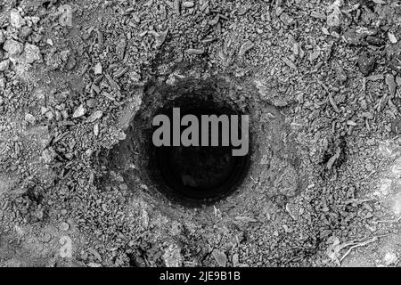 A drilled hole in the ground. Stock Photo