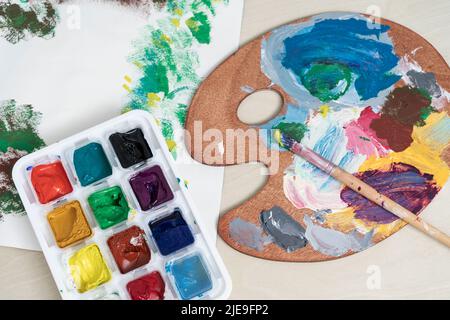 palette with brushes and paints Stock Photo