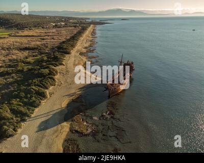 Dimitrios Shipwreck. Mysterious abandoned ship on Valtaki beach was a small, burned-out cargo ship for which there are several theories. Peloponnese Stock Photo