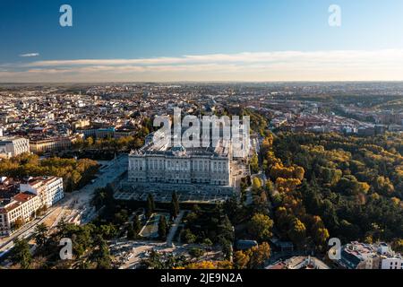 Aerial view of majestic building of Palacio Real de Madrid. Historic Royal palace and cityscape in golden hour. Madrid, Spain Stock Photo