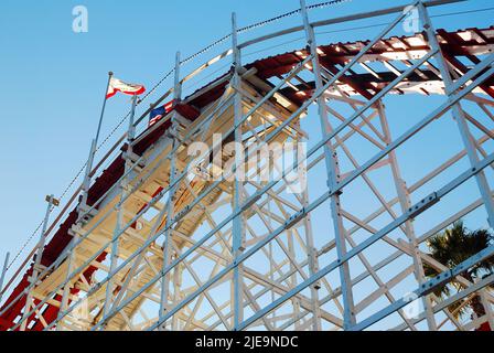 The tall  framework of a wooden rollercoaster Giant Dipper is shown as on the Boardwalk in Santa Cruz, California Stock Photo