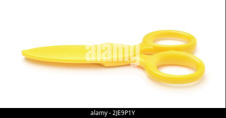 Children's yellow plastic scissors isolated on white. Stock Photo