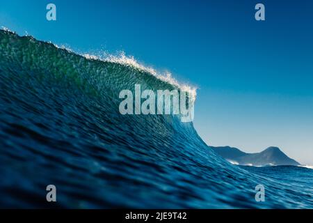 Peak of the wave in ocean. Crashing perfect wave, ideal for surfing Stock Photo