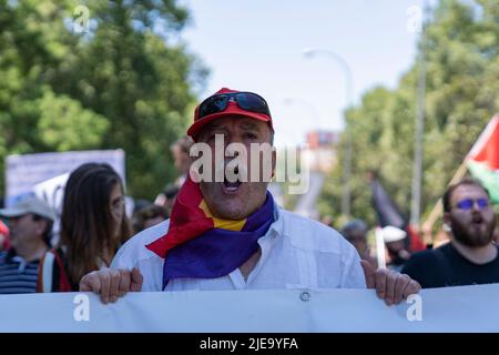 Madrid, Spain. 26th June, 2022. A man shouts slogans during the demonstration. Hundred of people took part in a demonstration against NATO summit that will take place in Madrid next week. (Photo by Guillermo Gutierrez/SOPA Image/Sipa USA) Credit: Sipa USA/Alamy Live News Stock Photo