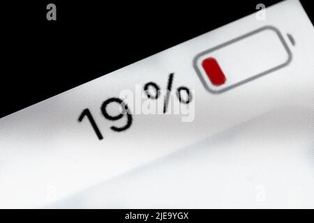 Smartphone battery level indicator - nineteen, 19 percent: close up macro Stock Photo