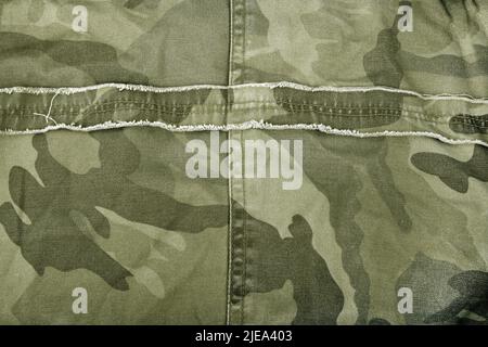 close up of the camouflage textured fabric wavy background Stock Photo