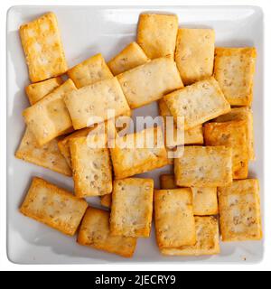 Thin crackers with sesame seeds on plate Stock Photo