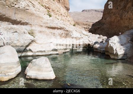 Refreshing swimming visit to Wadi Bani Khalid, Oman Stock Photo