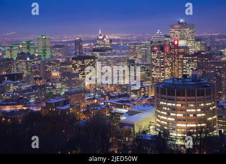 Montreal skyline illuminated at dusk in winter taken from the Mount Royal lookout, Quebec, Canada. Stock Photo