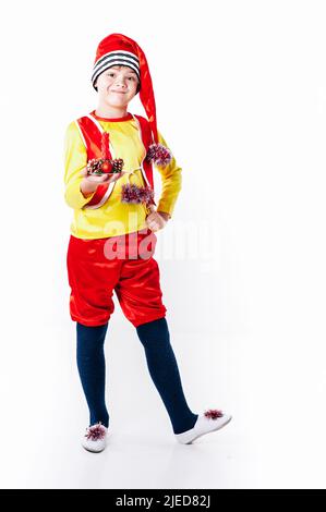 A baby dressed as a elf. isolated. Santa's helper. boy in suit of dwarf or elf Stock Photo