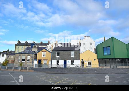 Houses and yachts in harbour by Caernarfon Castle in Wales UK. Stock Photo