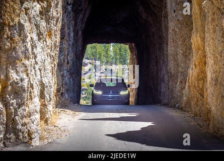 Car in Needles Eye Tunnel on the Needles Highway in Custer State Park in the Black Hills of South Dakota USA Stock Photo