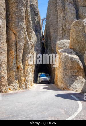 Car in Needles Eye Tunnel on the Needles Highway in Custer State Park in the Black Hills of South Dakota USA Stock Photo