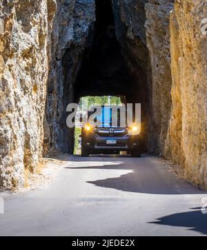 Car in Needles Eye Tunnel on the Needles Highway in Custer State Park in the Black Hills of South Dakota USA Stock Photo