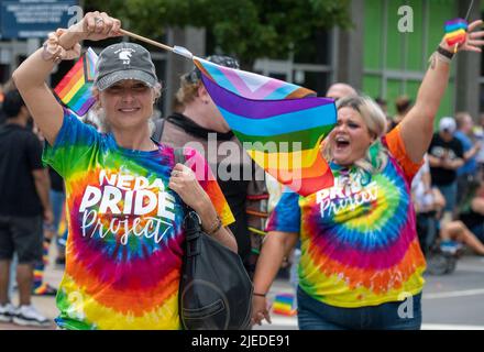 Wilkes Barre, United States. 26th June, 2022. Women wave rainbow flags while marching in the Gay Pride Parade. Wilkes-Barre, Pennsylvania held its first Gay Pride Parade. The parade made its way down Main Street and onto the Public Square where a party including drag performances, informational booths and LGBTQIA information could be found. Credit: SOPA Images Limited/Alamy Live News Stock Photo