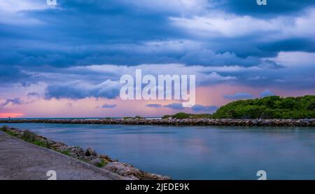 Stormy sky over the Gulf of Mexico at the Jetty in Venice Florida USA Stock Photo