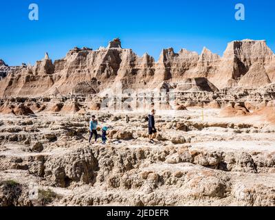 People on the Door Trail in Badlands National Park in South Dakota Stock Photo