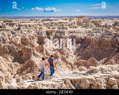 People on the Door Trail in Badlands National Park in South Dakota Stock Photo
