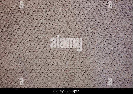 Grey mesh cloth texture with holes close up view Stock Photo