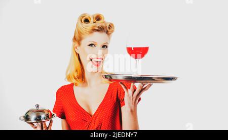 Wine presentation. Pin up waiter with alcohol and service tray. Restaurant serving. Stock Photo