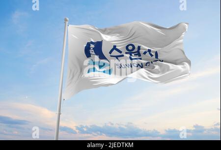 official flag of Suwon city, South Korea at cloudy sky background on ...