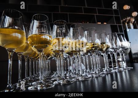 Stylish golden champagne in glasses. Anniversary celebration concept, christmas celebration. luxury catering at feast. Stock Photo