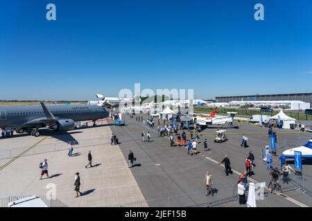 BERLIN, GERMANY - JUNE 23, 2022: Visitors to the exhibition on the airfield. Exhibition ILA Berlin Air Show 2022 Stock Photo