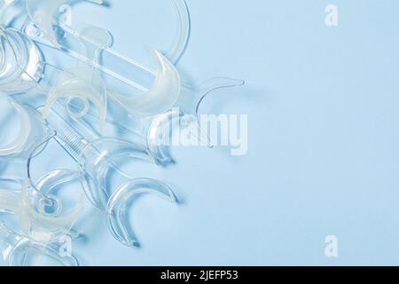 set of several Retractor Dental lip retractor Access to the oral cavity. Wide mouth opening for a dental procedure on a blue background Stock Photo