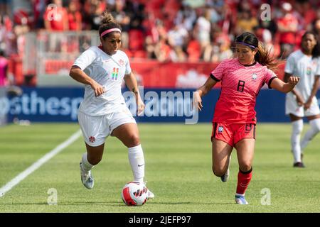 Toronto, Canada, June 26, 2022: Desiree Scott (left) of Team Canada and Cho So-hyun (right) of Team Korea Republic compete for the ball during the International Friendly Match at BMO Field in Toronto, Canada. Canada and Korea draw 0-0. Credit: Phamai Techaphan/Alamy Live News Stock Photo